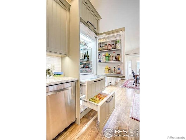 kitchen featuring light wood finished floors, light countertops, open shelves, and dishwasher