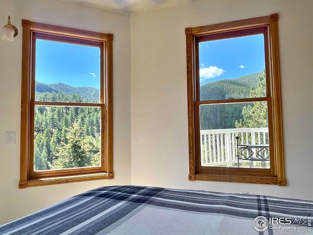 unfurnished bedroom featuring a mountain view