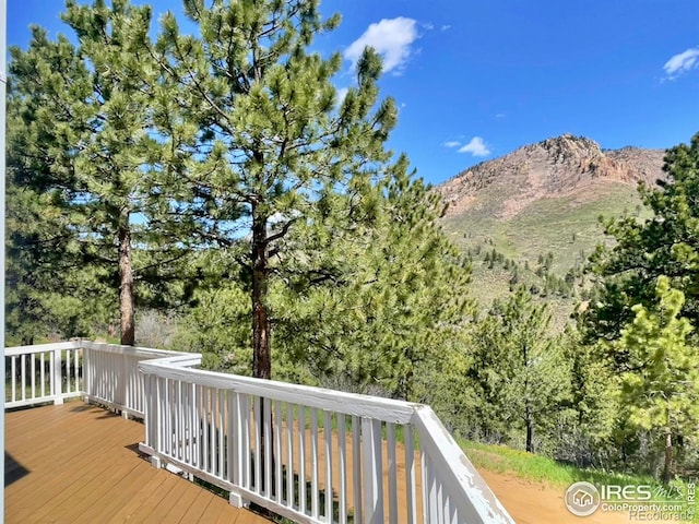 wooden terrace featuring a mountain view