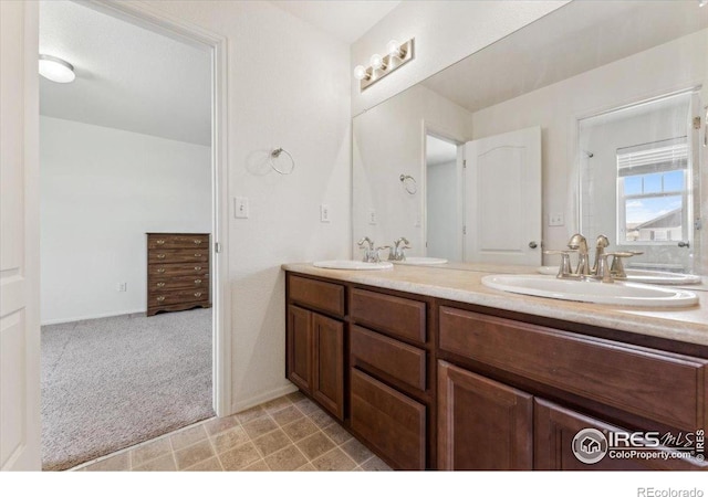 bathroom featuring double vanity