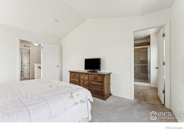 bedroom with lofted ceiling, visible vents, and carpet floors