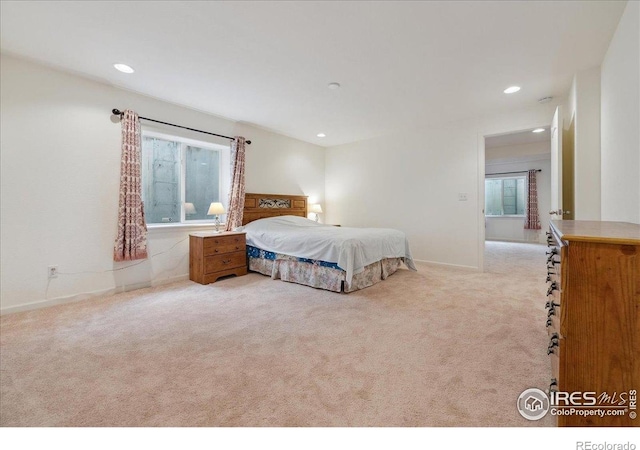 bedroom with light carpet, multiple windows, recessed lighting, and baseboards