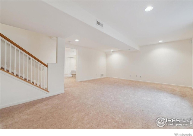 finished basement with recessed lighting, carpet, baseboards, and stairway