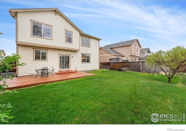 rear view of house with a patio and cooling unit