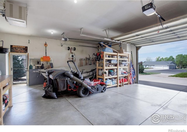 garage featuring a heating unit and a garage door opener