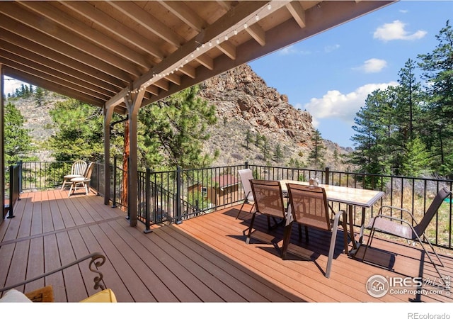 wooden deck with outdoor dining area