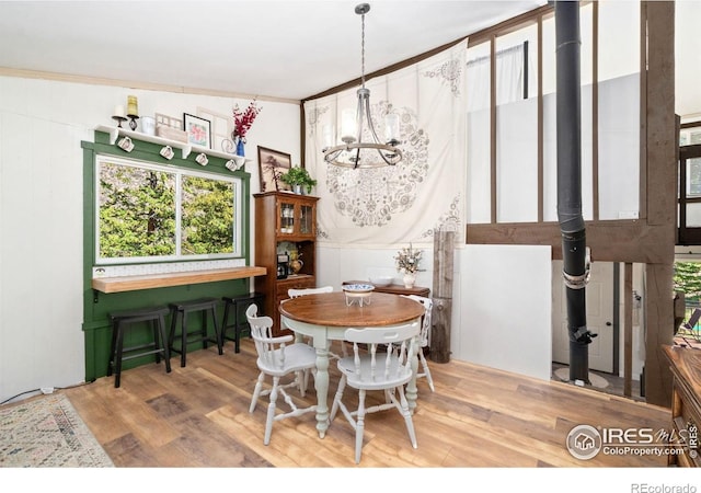 dining room with a chandelier and wood finished floors