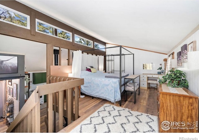 bedroom with wood finished floors