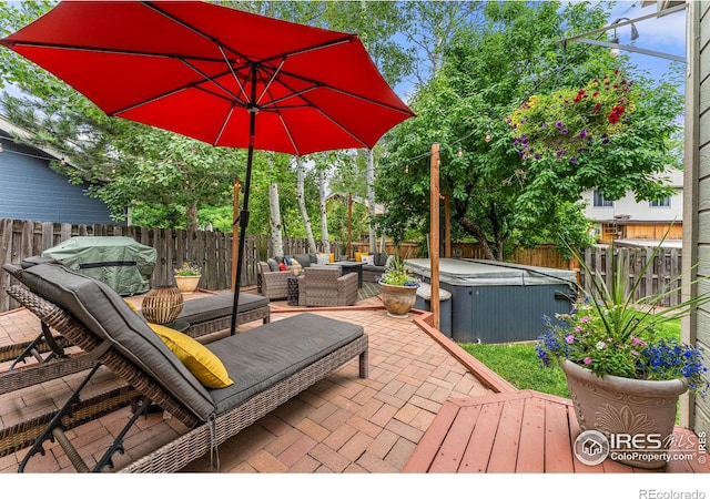2819 Seccomb St, Fort Collins, CO 80526 - fenced backyard featuring a hot tub, outdoor lounge area, and a patio area