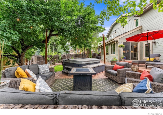 2819 Seccomb St, Fort Collins, CO 80526 - fenced backyard with a hot tub, an outdoor living space, and a patio area