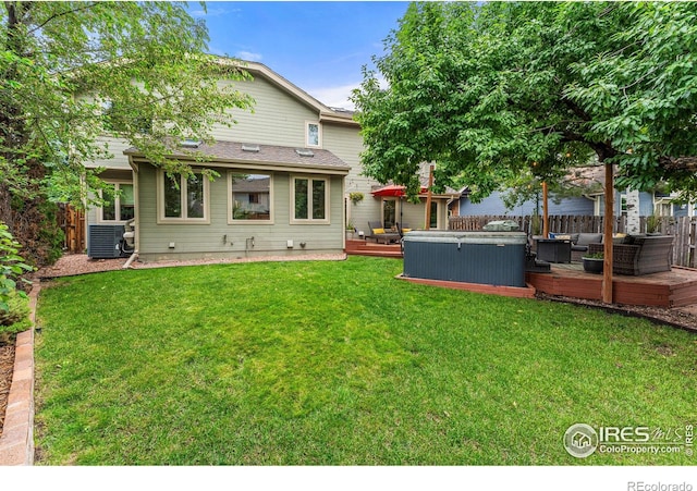 2819 Seccomb St, Fort Collins, CO 80526 - rear view of property with a hot tub and a wooden deck
