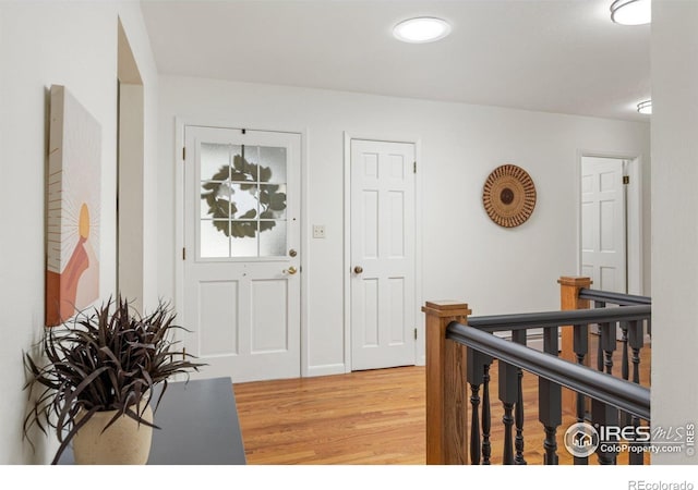 entryway with light wood-style floors