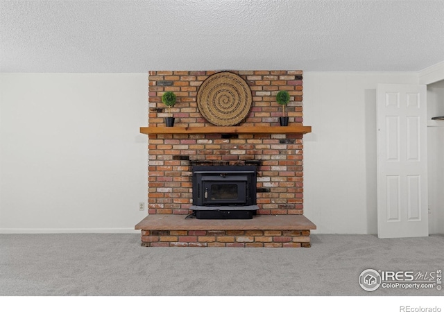 interior details with carpet flooring and a textured ceiling