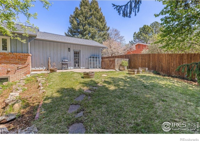 view of yard with a fenced backyard