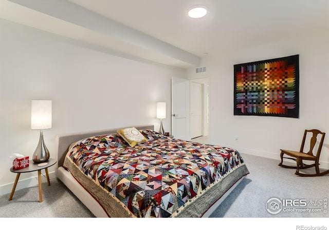 carpeted bedroom with baseboards and visible vents