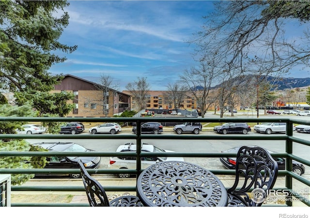 balcony featuring a mountain view