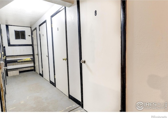 corridor featuring visible vents and concrete flooring