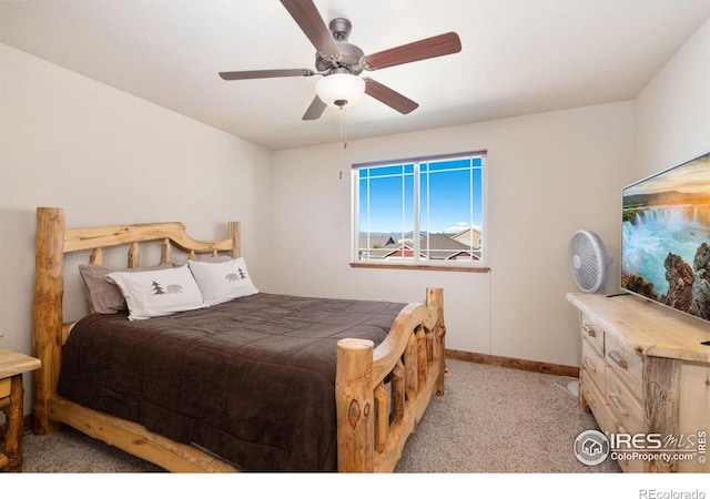 7084 Sumner St, Wellington, CO 80549 - bedroom with light carpet, baseboards, and a ceiling fan