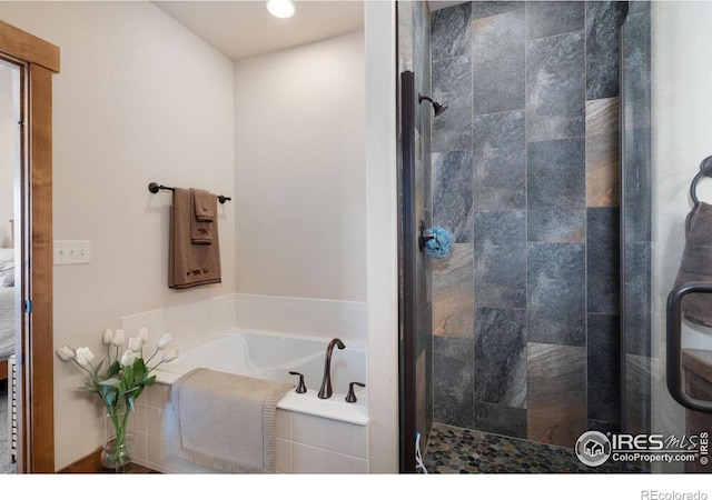 7084 Sumner St, Wellington, CO 80549 - bathroom featuring a garden tub and a stall shower