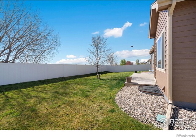 7084 Sumner St, Wellington, CO 80549 - view of yard featuring a fenced backyard