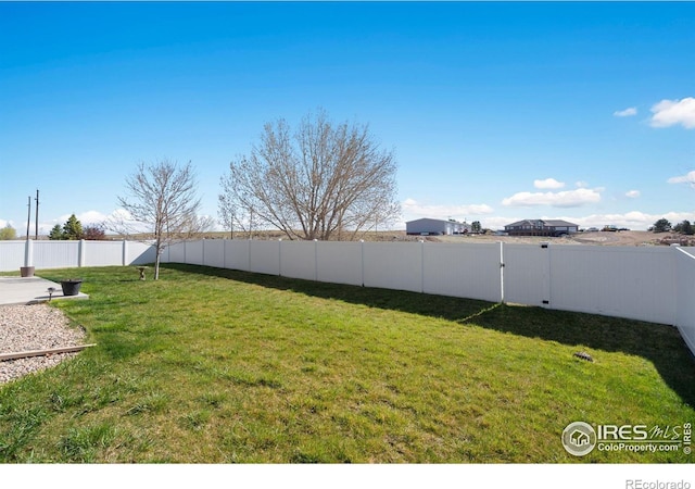 7084 Sumner St, Wellington, CO 80549 - view of yard featuring a fenced backyard
