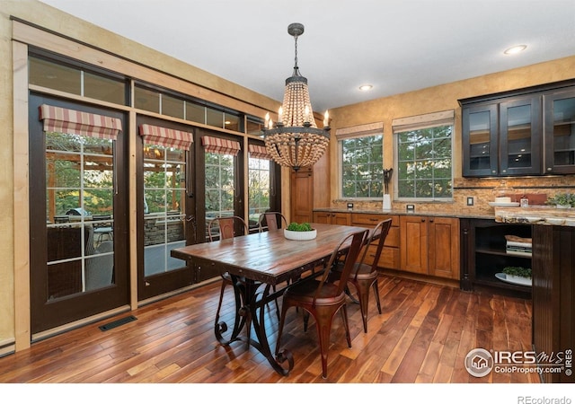 14582 Homestead Pl, Broomfield, CO 80023 - dining area featuring a chandelier, dark wood-style floors, and recessed lighting