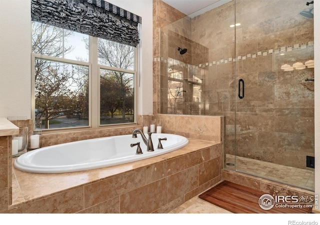 14582 Homestead Pl, Broomfield, CO 80023 - bathroom with a stall shower and a bath