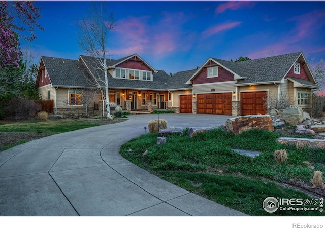 14582 Homestead Pl, Broomfield, CO 80023 - craftsman inspired home featuring a porch, stone siding, curved driveway, and an attached garage