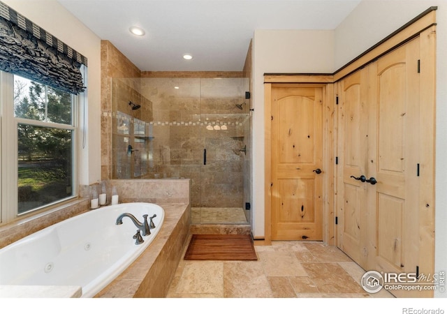 14582 Homestead Pl, Broomfield, CO 80023 - full bath with a stall shower, a whirlpool tub, recessed lighting, and stone finish floors