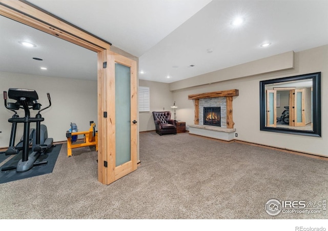 14582 Homestead Pl, Broomfield, CO 80023 - living room featuring carpet flooring, recessed lighting, a warm lit fireplace, and baseboards