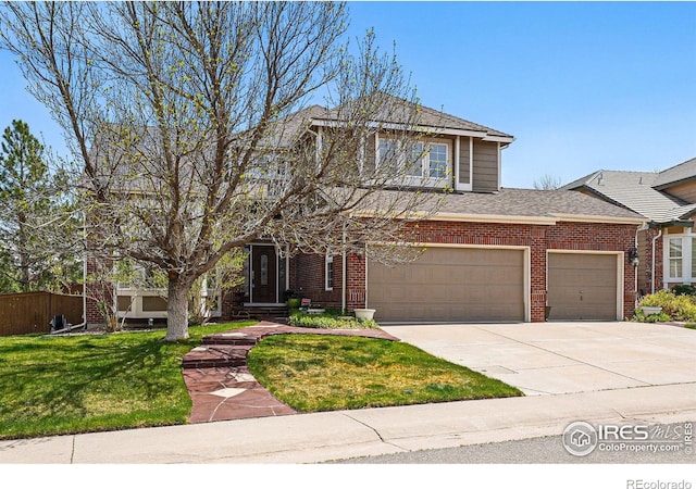 10305 Charissglen Cir, Highlands Ranch, CO 80126 - view of front of property featuring a front lawn, driveway, brick siding, and a shingled roof