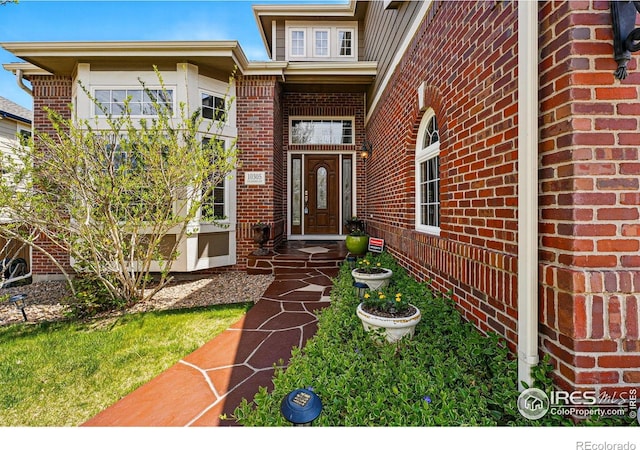 10305 Charissglen Cir, Highlands Ranch, CO 80126 - doorway to property featuring brick siding