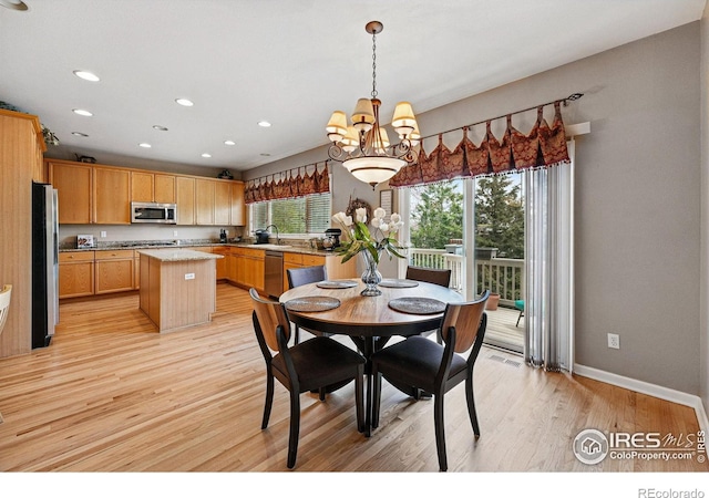 10305 Charissglen Cir, Highlands Ranch, CO 80126 - dining space with a chandelier, light wood finished floors, and recessed lighting