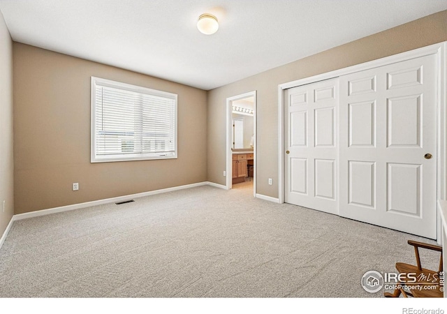 10305 Charissglen Cir, Highlands Ranch, CO 80126 - unfurnished bedroom with carpet floors, a closet, and ensuite bath