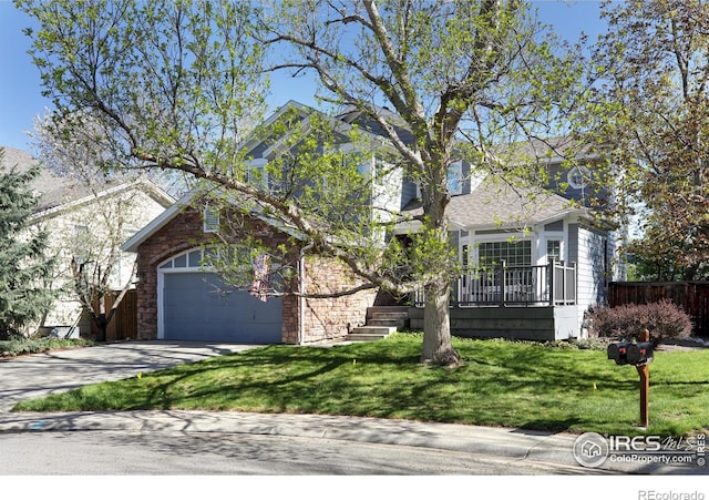 1809 Keel Ct, Lafayette, CO 80026 - obstructed view of property featuring concrete driveway, a front lawn, and fence