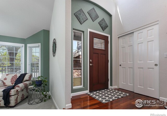 1809 Keel Ct, Lafayette, CO 80026 - entrance foyer featuring baseboards, wood finished floors, and lofted ceiling