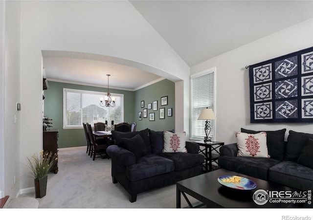 1809 Keel Ct, Lafayette, CO 80026 - living room featuring lofted ceiling, baseboards, a chandelier, arched walkways, and carpet floors