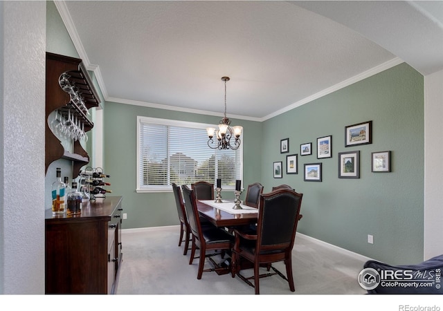 1809 Keel Ct, Lafayette, CO 80026 - dining room featuring ornamental molding, light carpet, an inviting chandelier, and baseboards