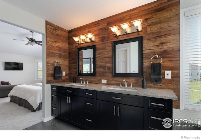 1809 Keel Ct, Lafayette, CO 80026 - bathroom with double vanity, wood walls, and a sink