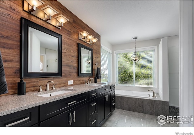 1809 Keel Ct, Lafayette, CO 80026 - bathroom with a bath, wooden walls, double vanity, and a sink