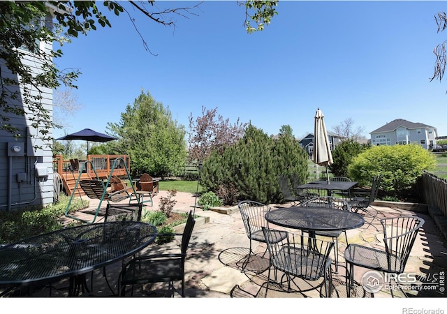1809 Keel Ct, Lafayette, CO 80026 - view of patio featuring fence and outdoor dining space