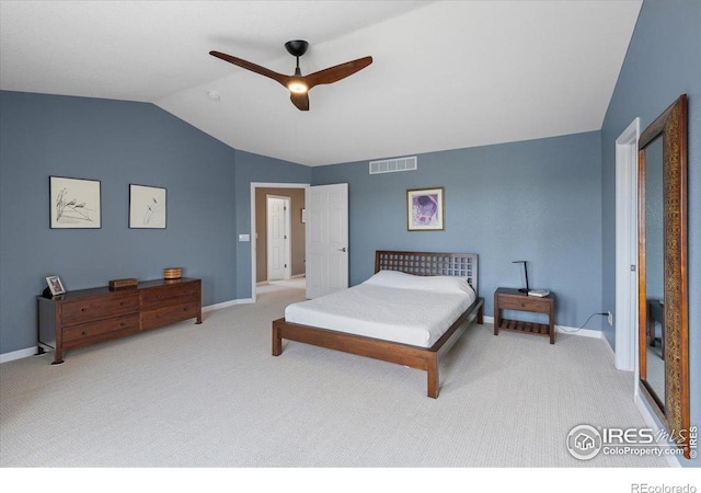 bedroom with lofted ceiling, carpet floors, baseboards, and visible vents