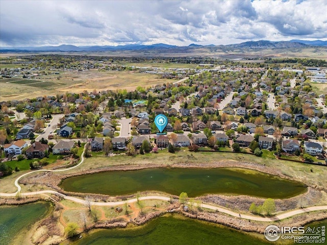 aerial view featuring a residential view and a water and mountain view