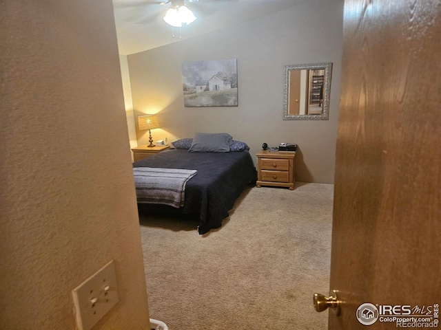 bedroom with ceiling fan and carpet floors
