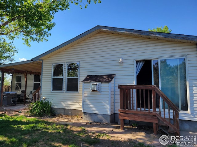 104 Gateway Ave, Fort Morgan, CO 80701 - back of property featuring a patio area