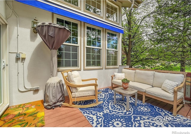 2206 Eagles Nest Dr, Lafayette, CO 80026 - wooden terrace featuring an outdoor living space