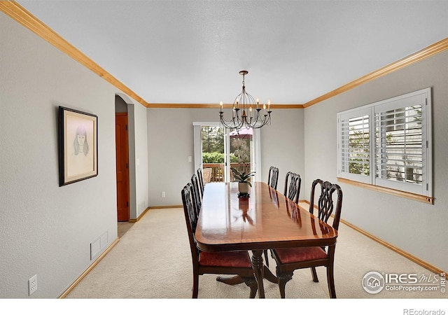 2206 Eagles Nest Dr, Lafayette, CO 80026 - dining space featuring baseboards, light carpet, a chandelier, and visible vents