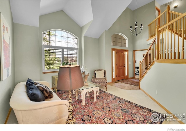 2206 Eagles Nest Dr, Lafayette, CO 80026 - foyer entrance featuring a chandelier, stairway, and high vaulted ceiling