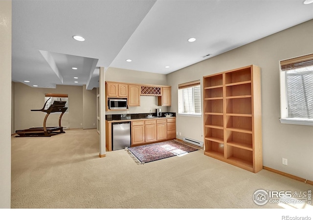 2206 Eagles Nest Dr, Lafayette, CO 80026 - kitchen featuring a sink, light brown cabinetry, stainless steel appliances, a baseboard heating unit, and light colored carpet