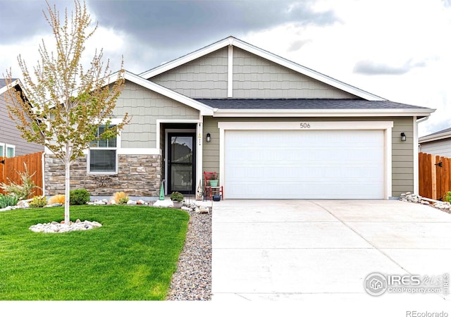 506 Bobcat Ct, Wiggins, CO 80654 - view of front of house with an attached garage, driveway, stone siding, and roof with shingles